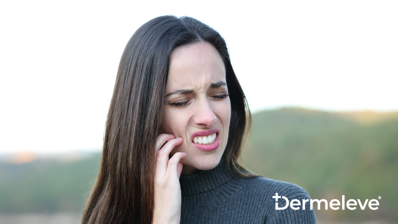 A woman shows discomfort suffering from itchy skin